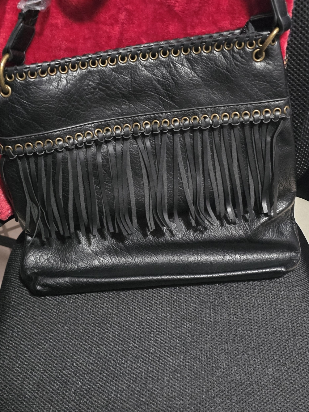 Black Fringe Shoulder Bag with Grommet Accent
